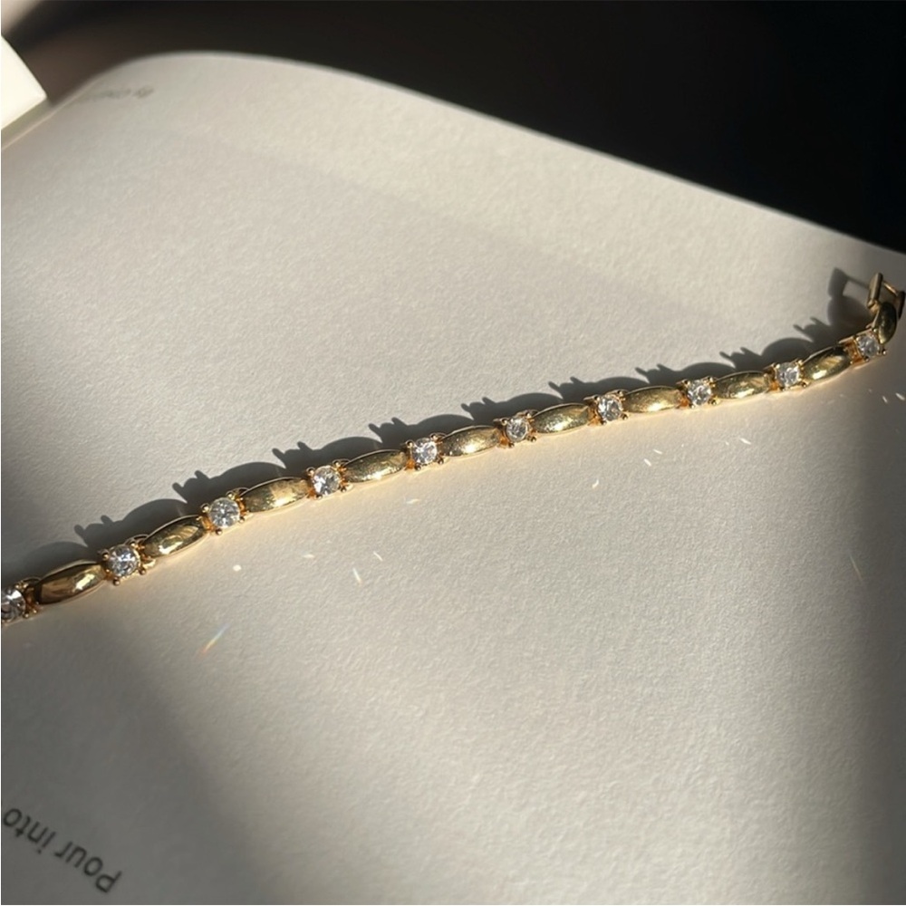 Avon | signed stamped gold plated rhinestone crystal flex tennis bracelet